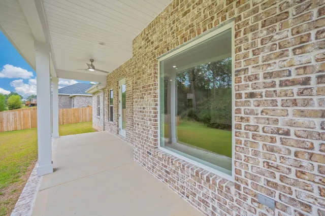 a view of porch with a door and chair