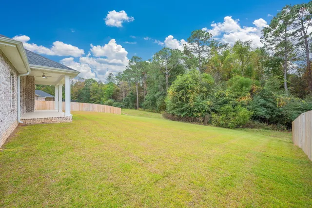 a view of a house with a big yard