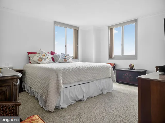 a bedroom with a bed and a dresser