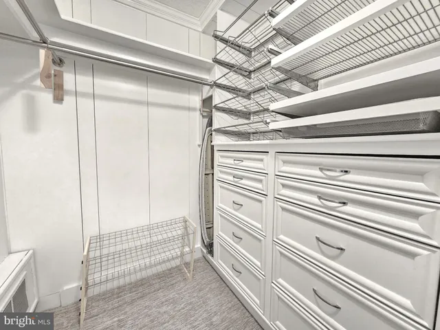 a view of a room with racks on the wall