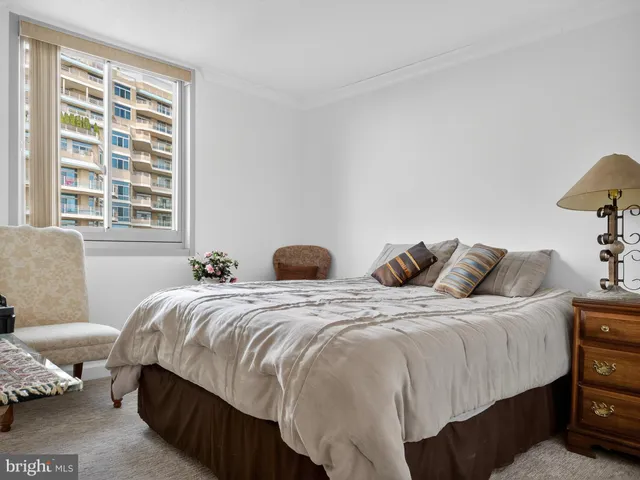 a bedroom with two beds and a couch