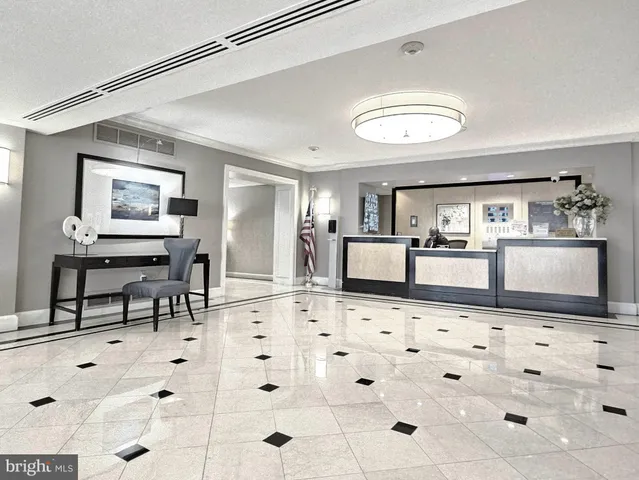 a kitchen with granite countertop a sink and cabinets