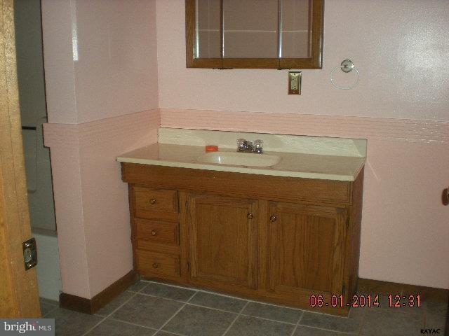 176 St Bartholomew Road Hanover, PA 17331 - Photo 8 of 11 a bathroom with a sink a vanity and a mirror
