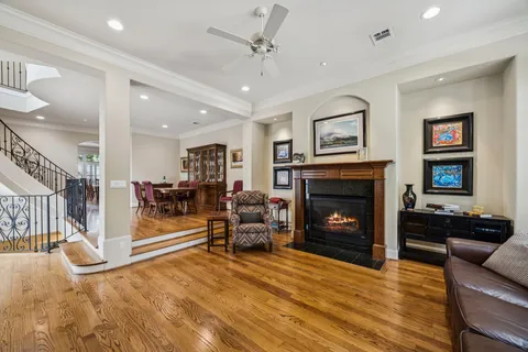 a view of a kitchen with furniture and wooden floor