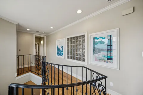 a spacious bedroom with a bed and a window