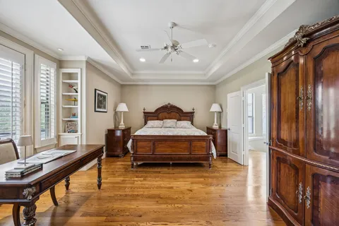 a room with furniture and large windows