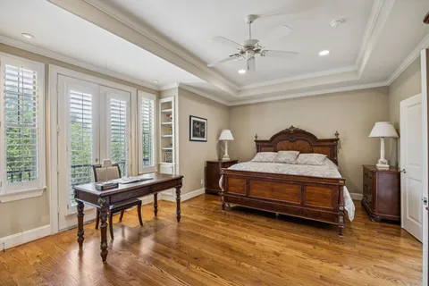 a spacious en suite bathroom with a double vanity sink mirror and a shower