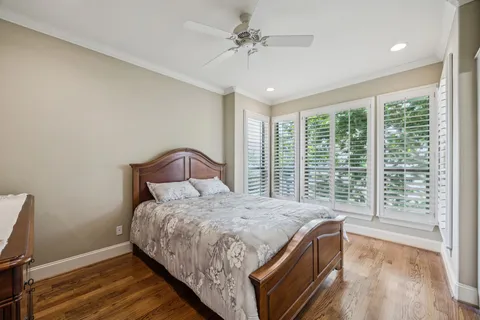 a bathroom with a granite countertop sink a toilet and a mirror