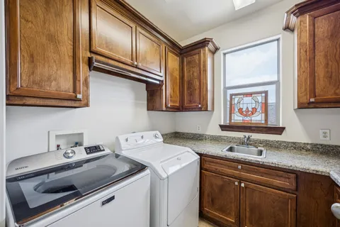 a view of a porch with furniture and garden