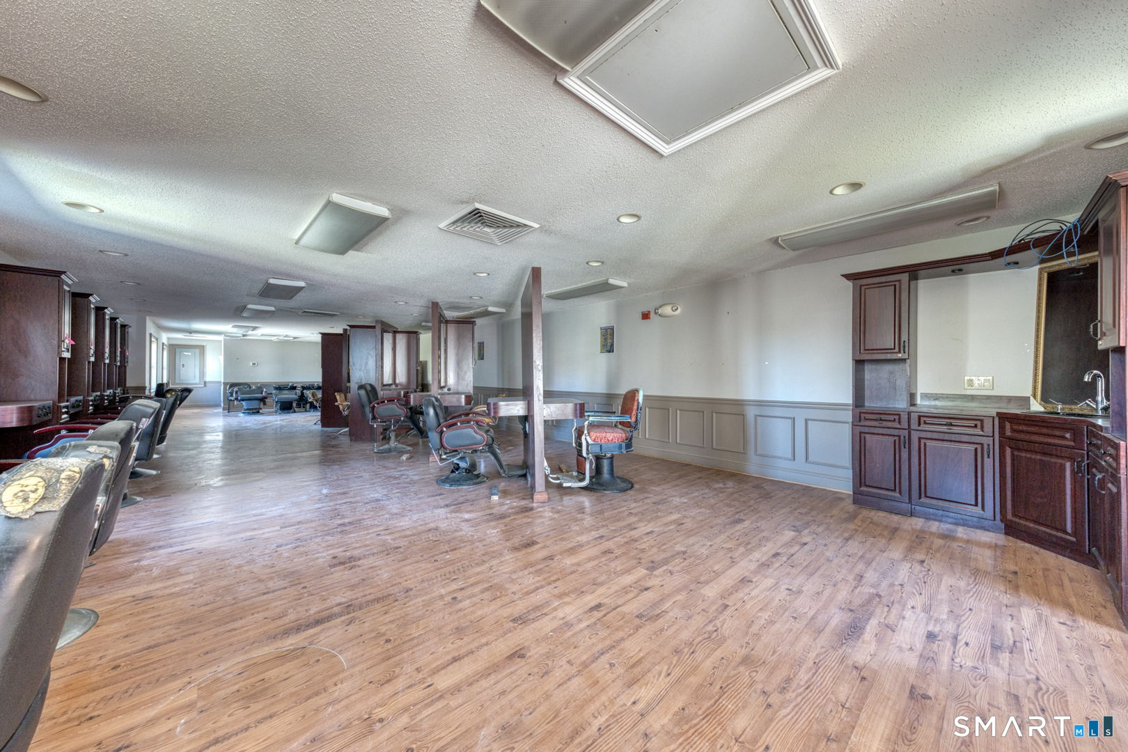 2404 Main Street Hartford, CT 06120 - Photo 18 of 37 a living room with lots of furniture and wooden floors