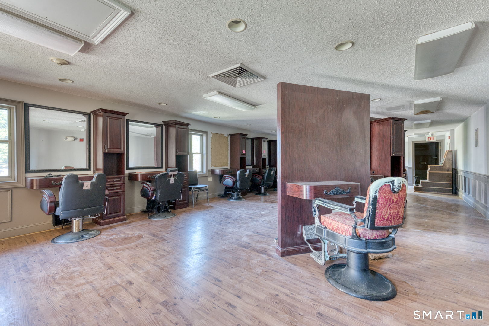 2404 Main Street Hartford, CT 06120 - Photo 19 of 37 a living room with furniture gym equipment and a chandelier