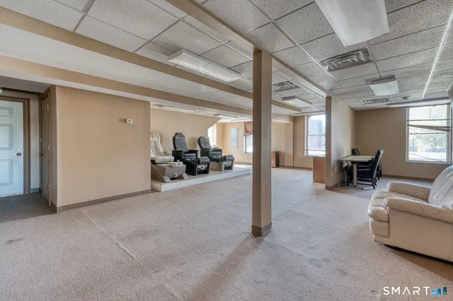 a view of a livingroom with furniture and a livingroom
