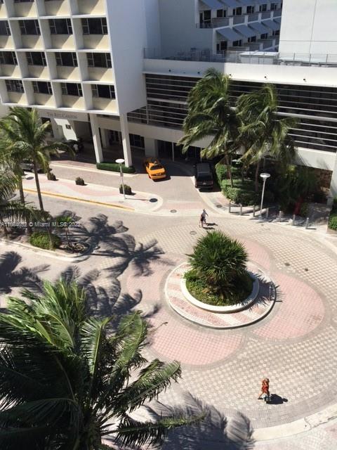 100 Lincoln Road, Unit 637 Miami Beach, FL 33139 - Photo 12 of 13 a swimming pool with buildings in the background