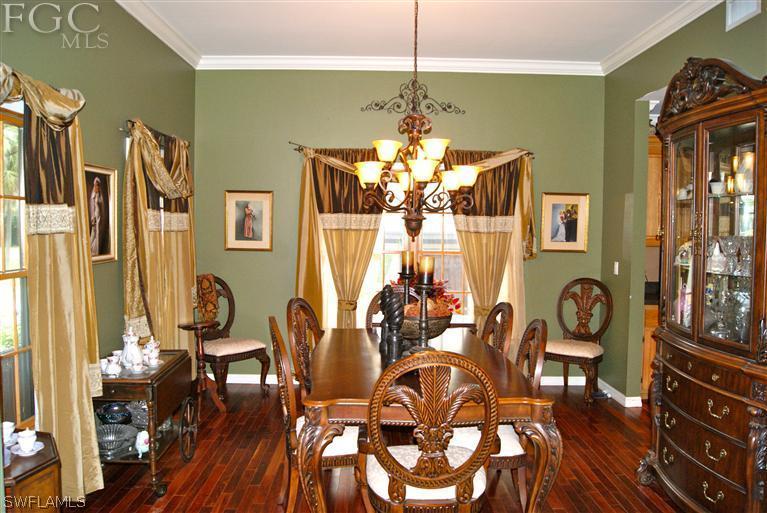 17180 Frank Road Alva, FL 33920 - Photo 12 of 23 a view of a dining room with furniture and wooden floor
