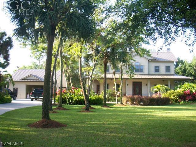 17180 Frank Road Alva, FL 33920 - Photo 2 of 23 a front view of house with yard and green space