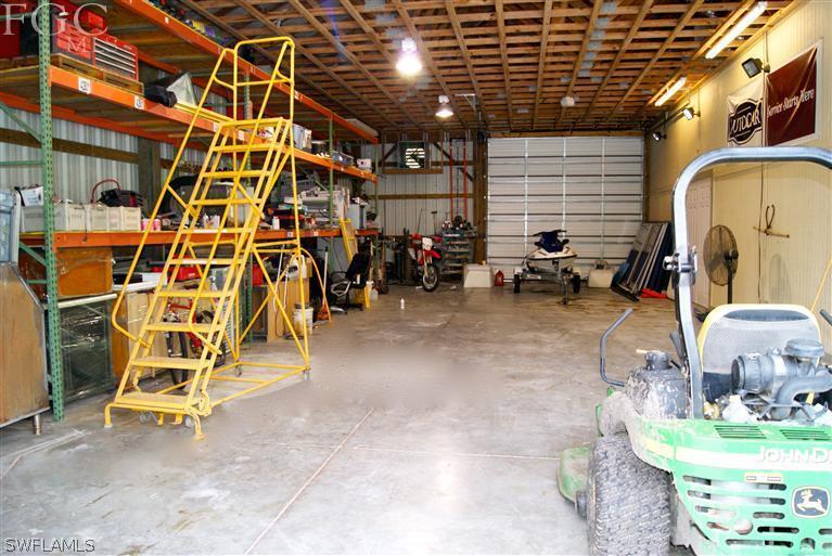 17180 Frank Road Alva, FL 33920 - Photo 22 of 23 a view of a room with gym equipment