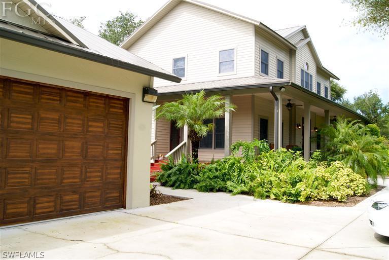 17180 Frank Road Alva, FL 33920 - Photo 4 of 23 a view of a house with potted plants