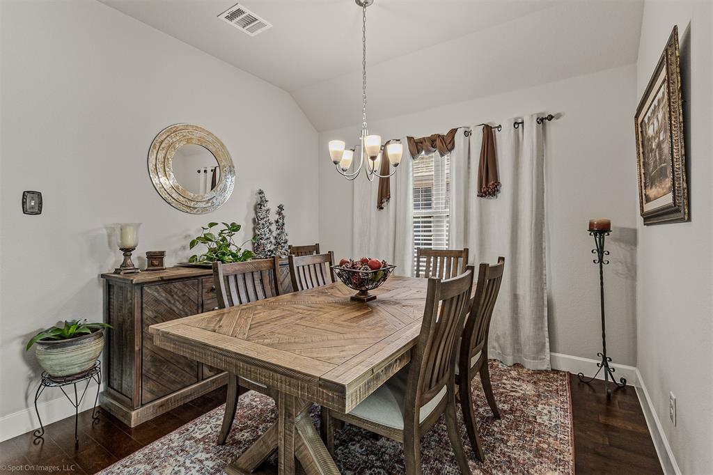 2064 Glaston Road Forney, TX 75126 - Photo 13 of 36 a view of a dining room with furniture and chandelier