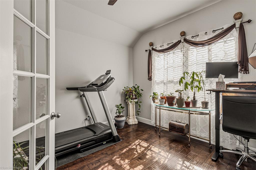 2064 Glaston Road Forney, TX 75126 - Photo 15 of 36 a room with gym equipment and a window