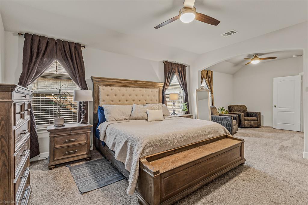 2064 Glaston Road Forney, TX 75126 - Photo 16 of 36 a bed room with a bed and a television