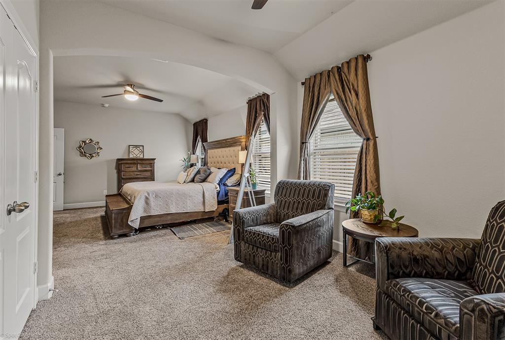 2064 Glaston Road Forney, TX 75126 - Photo 19 of 36 a bedroom with furniture and a large window