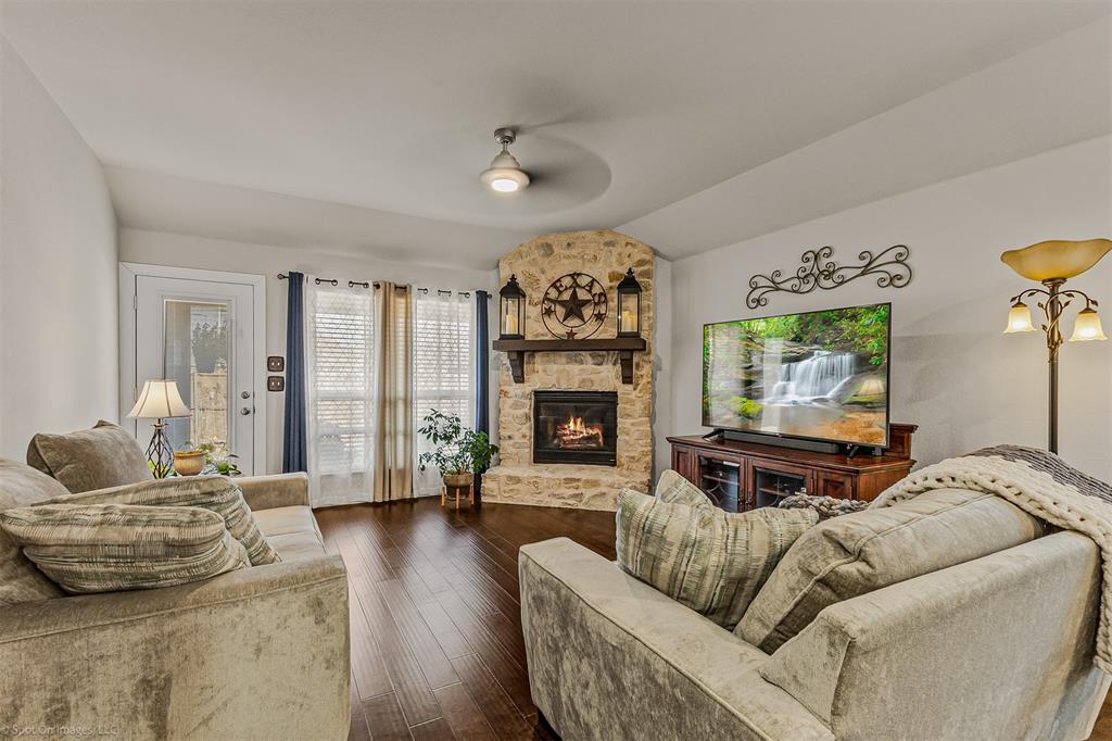 2064 Glaston Road Forney, TX 75126 - Photo 2 of 36 a living room with furniture and a fireplace