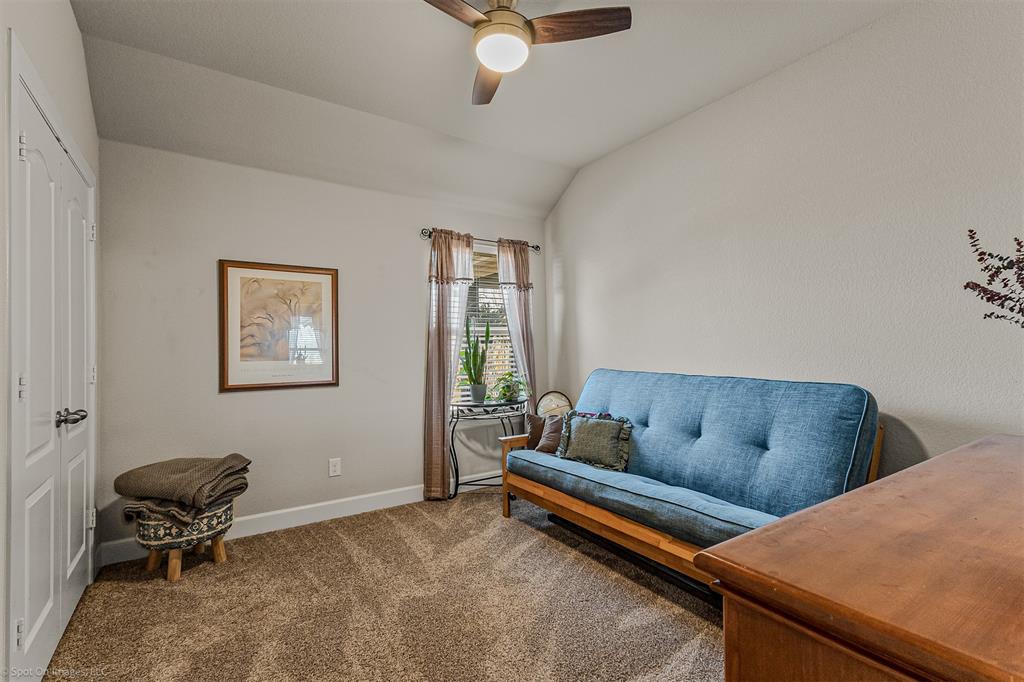 2064 Glaston Road Forney, TX 75126 - Photo 24 of 36 a living room with furniture and a window