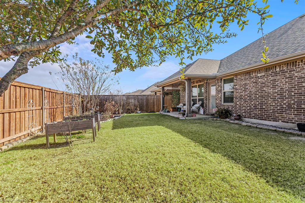 2064 Glaston Road Forney, TX 75126 - Photo 28 of 36 a view of house with backyard and a slide