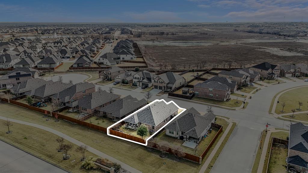 2064 Glaston Road Forney, TX 75126 - Photo 34 of 36 an aerial view of residential houses with outdoor space