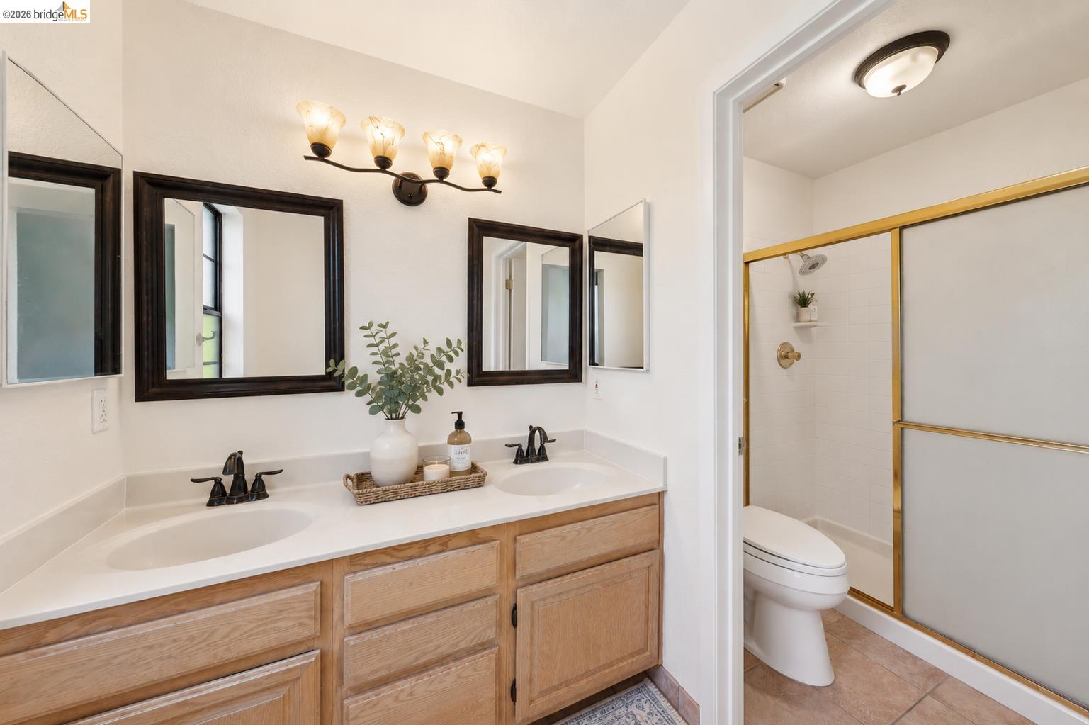 261 Redhawk Road Novato, CA 94949 - Photo 33 of 44 Bathroom vanity featuring dual under-mount sinks with matte black faucets