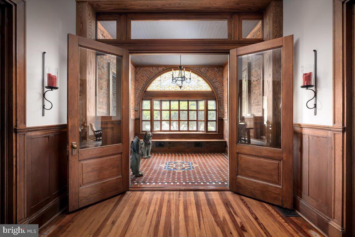 202 South Washington Street Winchester, VA 22601 - Photo 16 of 71 a view of a hallway view with wooden floor and furniture