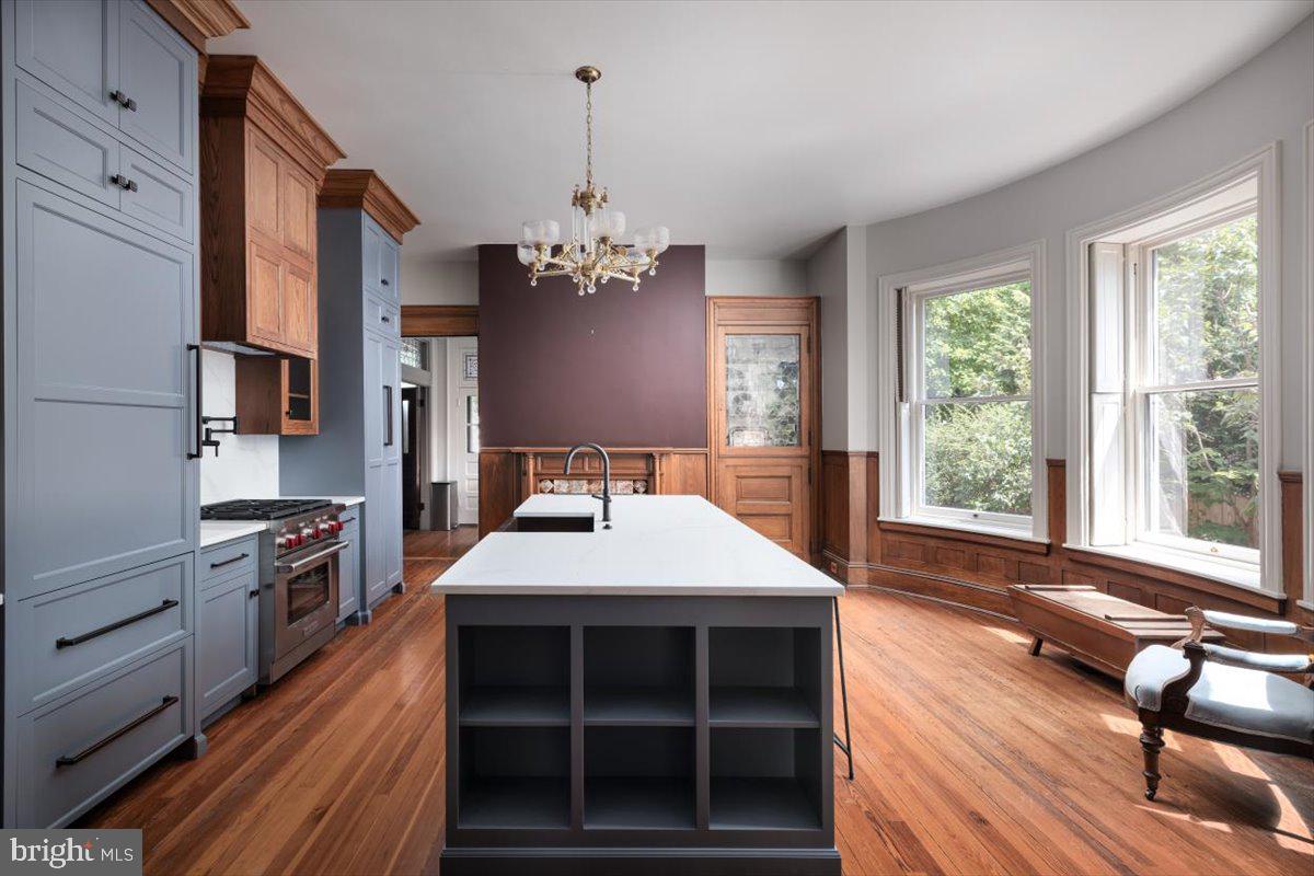 202 South Washington Street Winchester, VA 22601 - Photo 24 of 71 a large kitchen with stainless steel appliances a stove center island a window and cabinets