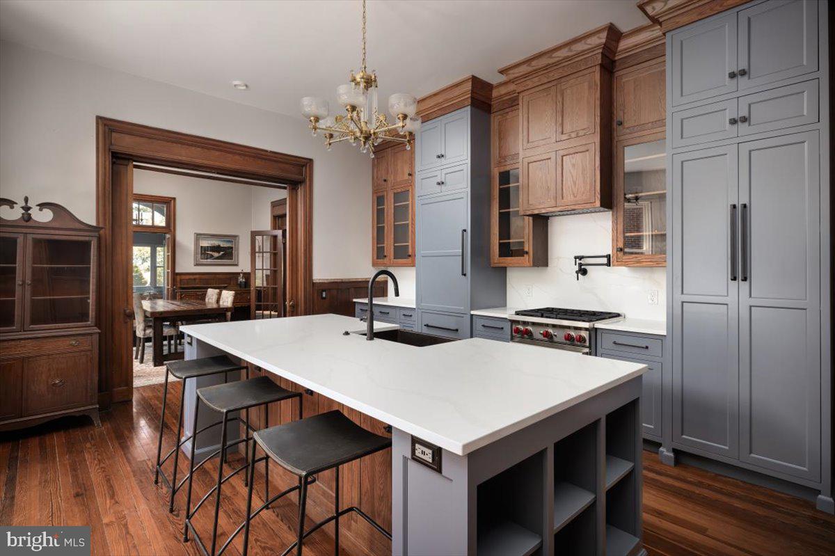 202 South Washington Street Winchester, VA 22601 - Photo 25 of 71 a kitchen that has a table chairs stainless steel appliances and cabinets
