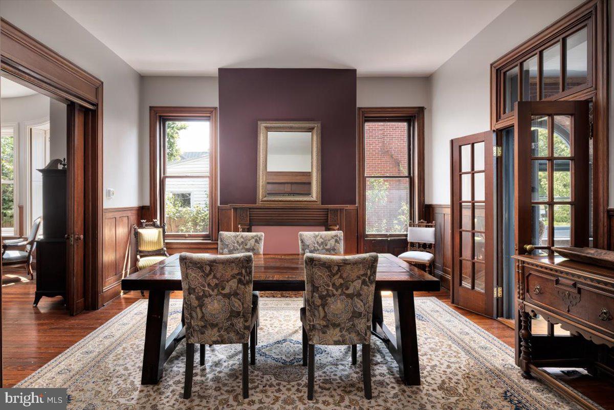 202 South Washington Street Winchester, VA 22601 - Photo 26 of 71 a view of a dining room with furniture window and wooden floor