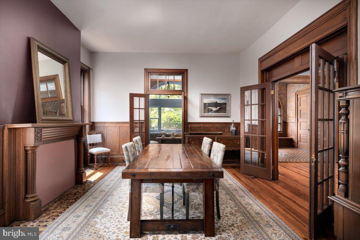 202 South Washington Street Winchester, VA 22601 - Photo 27 of 71 a view of a dining room with furniture window and wooden floor