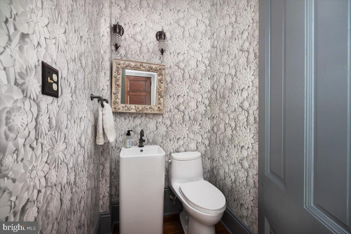 202 South Washington Street Winchester, VA 22601 - Photo 28 of 71 a bathroom with a toilet and a sink
