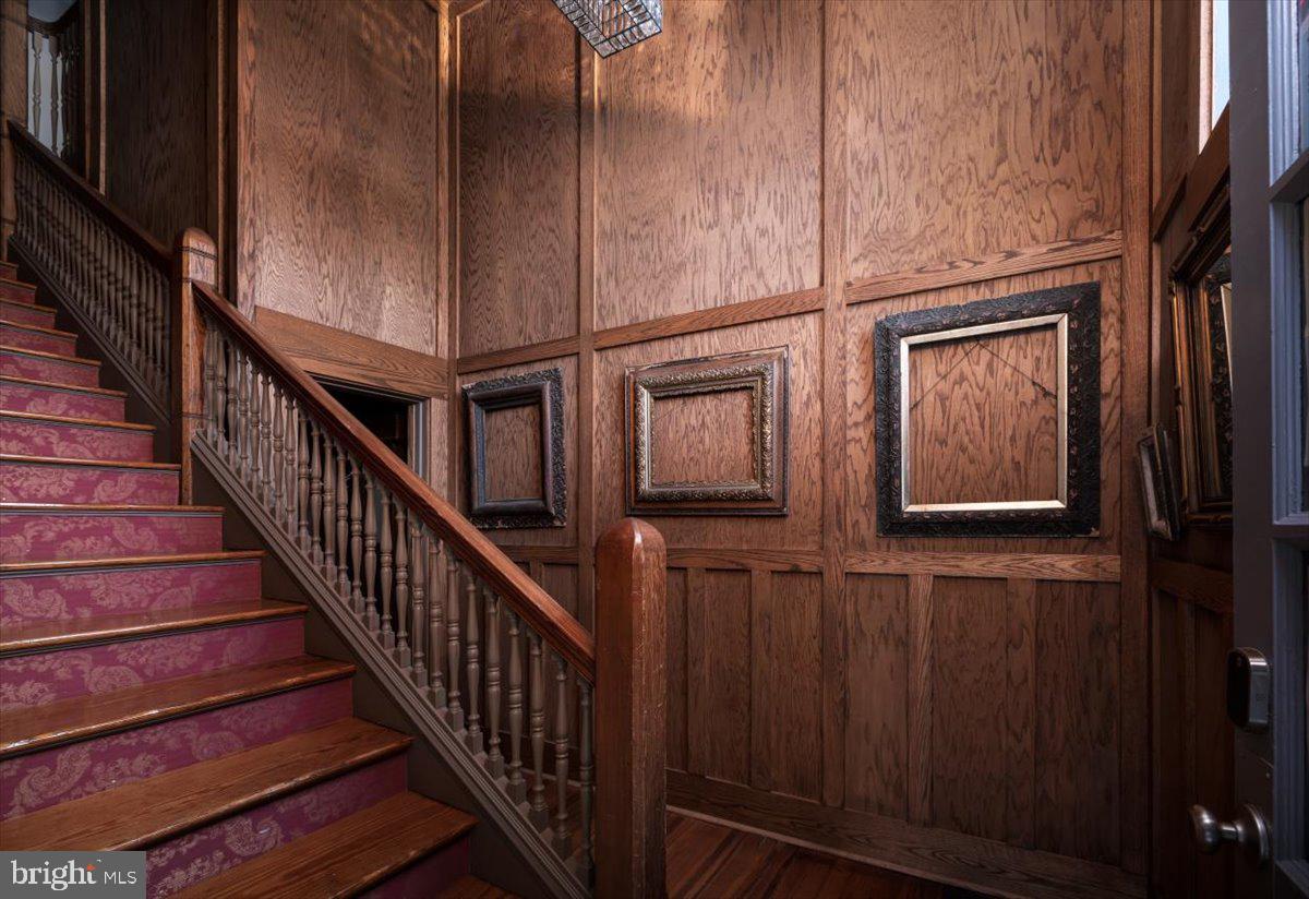 202 South Washington Street Winchester, VA 22601 - Photo 32 of 71 a view of staircase with lots of frames on wall