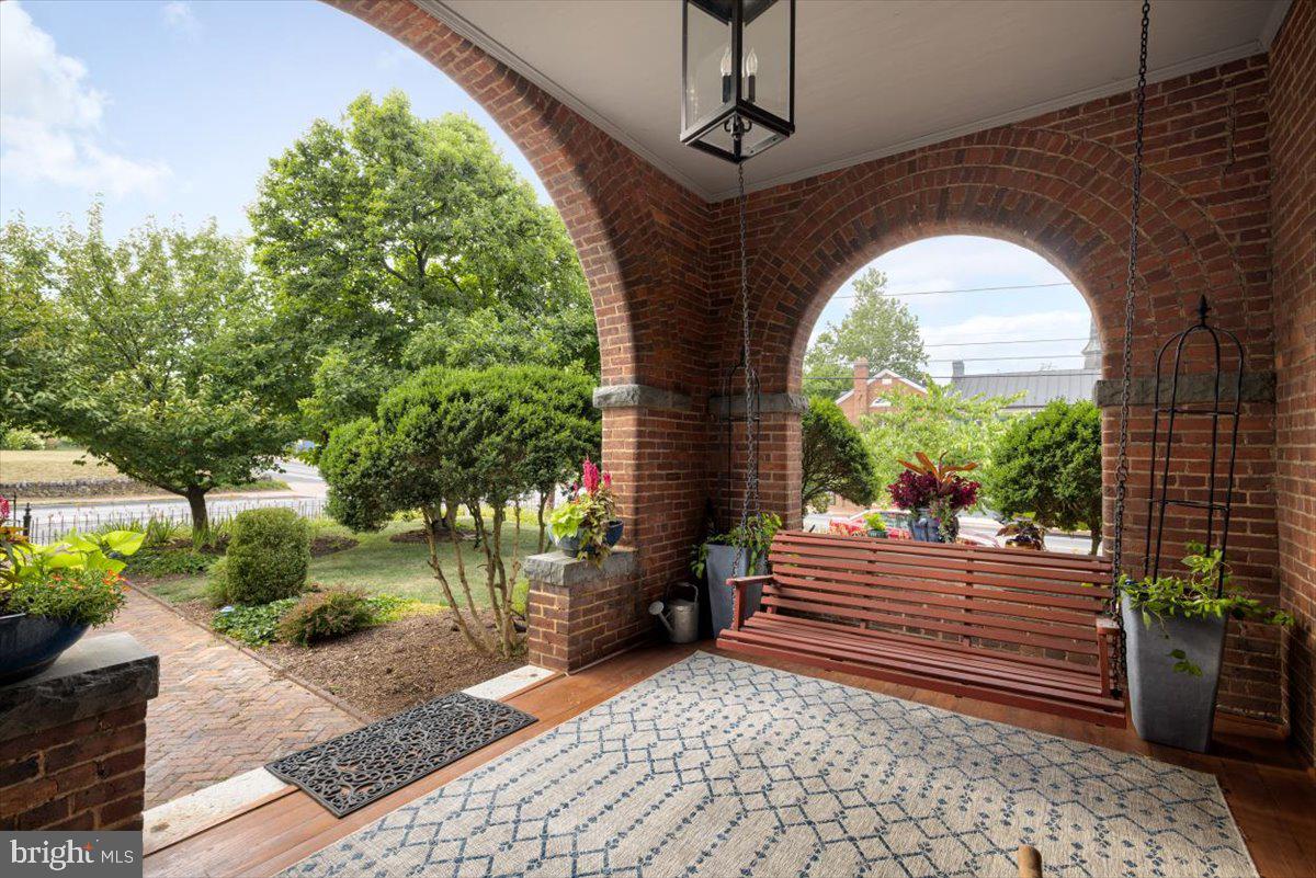 202 South Washington Street Winchester, VA 22601 - Photo 4 of 71 a view of a bench in a patio