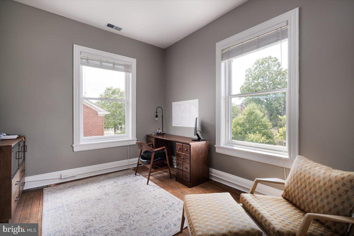 202 South Washington Street Winchester, VA 22601 - Photo 41 of 71 a bedroom with furniture and a window