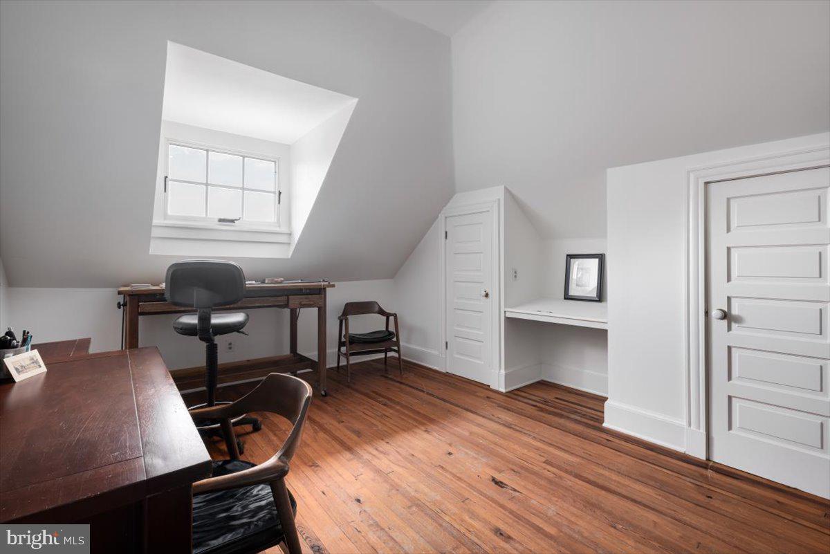 202 South Washington Street Winchester, VA 22601 - Photo 49 of 71 a workspace with wooden floor and furniture