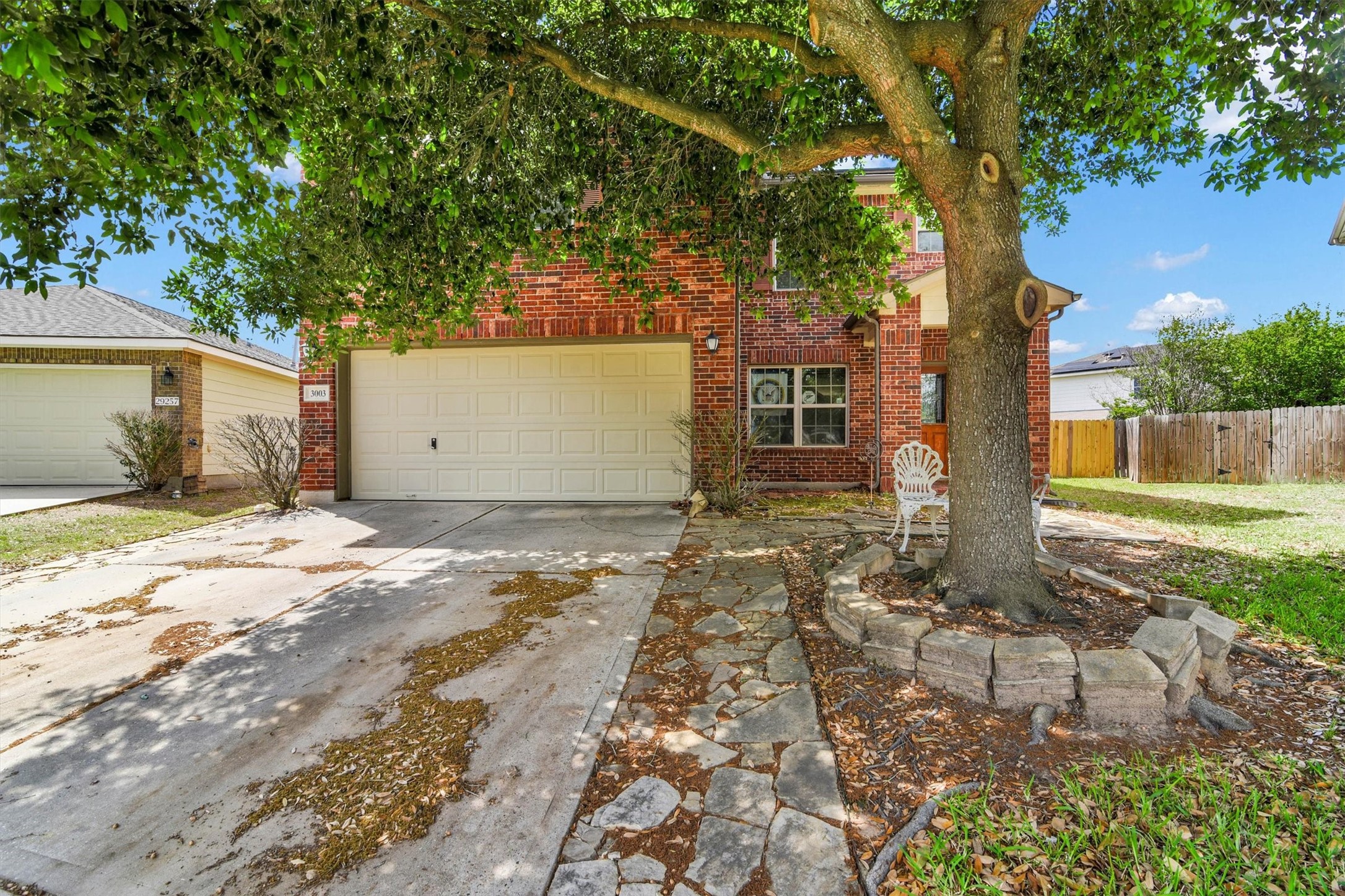 3003 Legends York Drive Spring, TX 77386 - Photo 2 of 29 a front view of a house with a yard and garage
