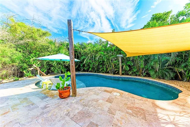 a view of a backyard with plants and garden