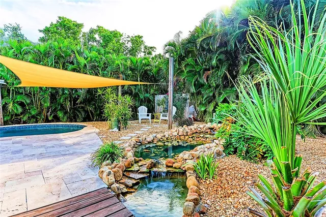 a view of a backyard with sitting area