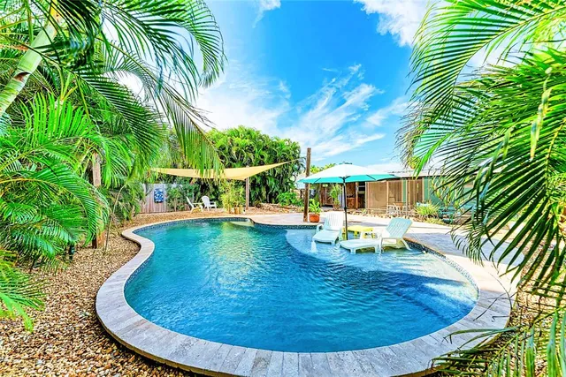 a view of swimming pool with seating space