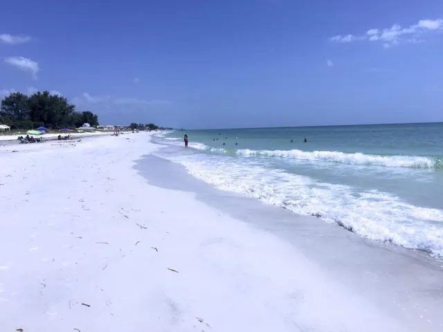 a view of a backyard with table and chairs