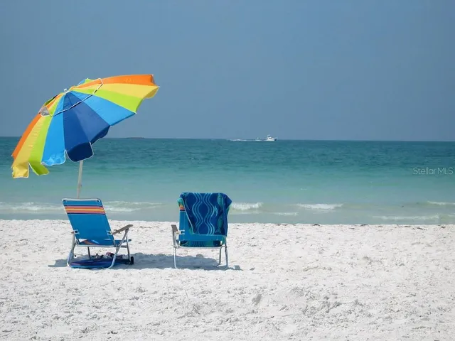 a view of swimming pool with seating space