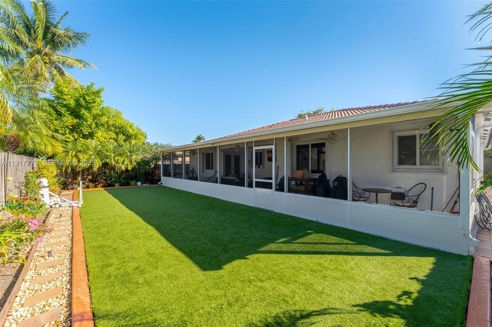 11347 Southwest 246th Terrace Homestead, FL 33032 - Photo 27 of 40 a view of a house with a yard porch and sitting area