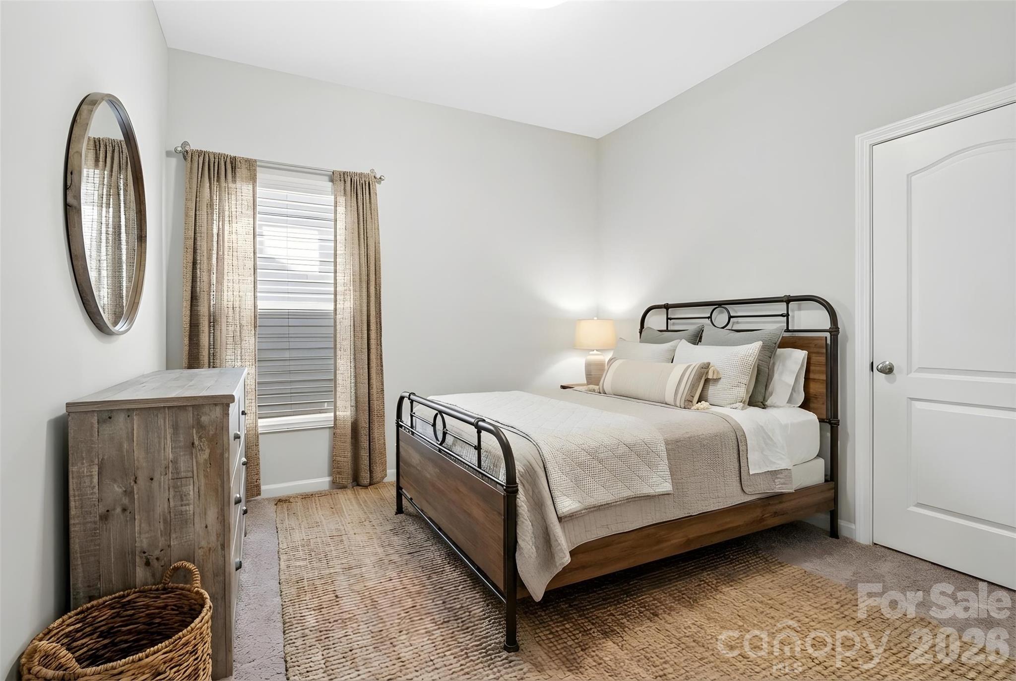 21260 Sanctuary Drive Lancaster, SC 29720 - Photo 20 of 44 a bedroom with a bed a mirror and dresser