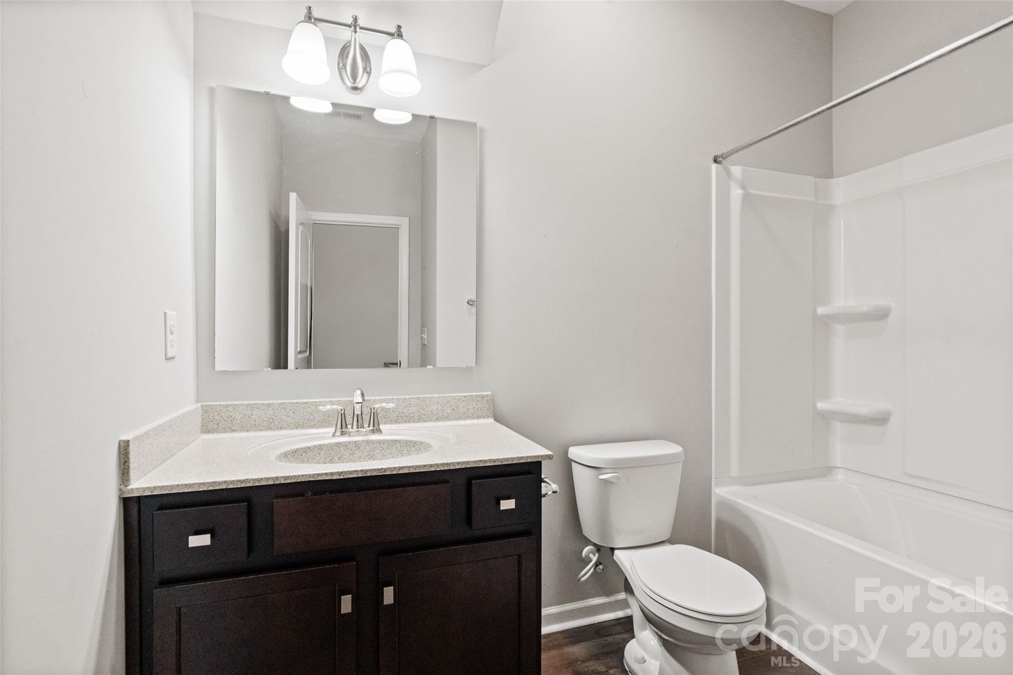 21260 Sanctuary Drive Lancaster, SC 29720 - Photo 23 of 44 a bathroom with a sink a toilet and shower