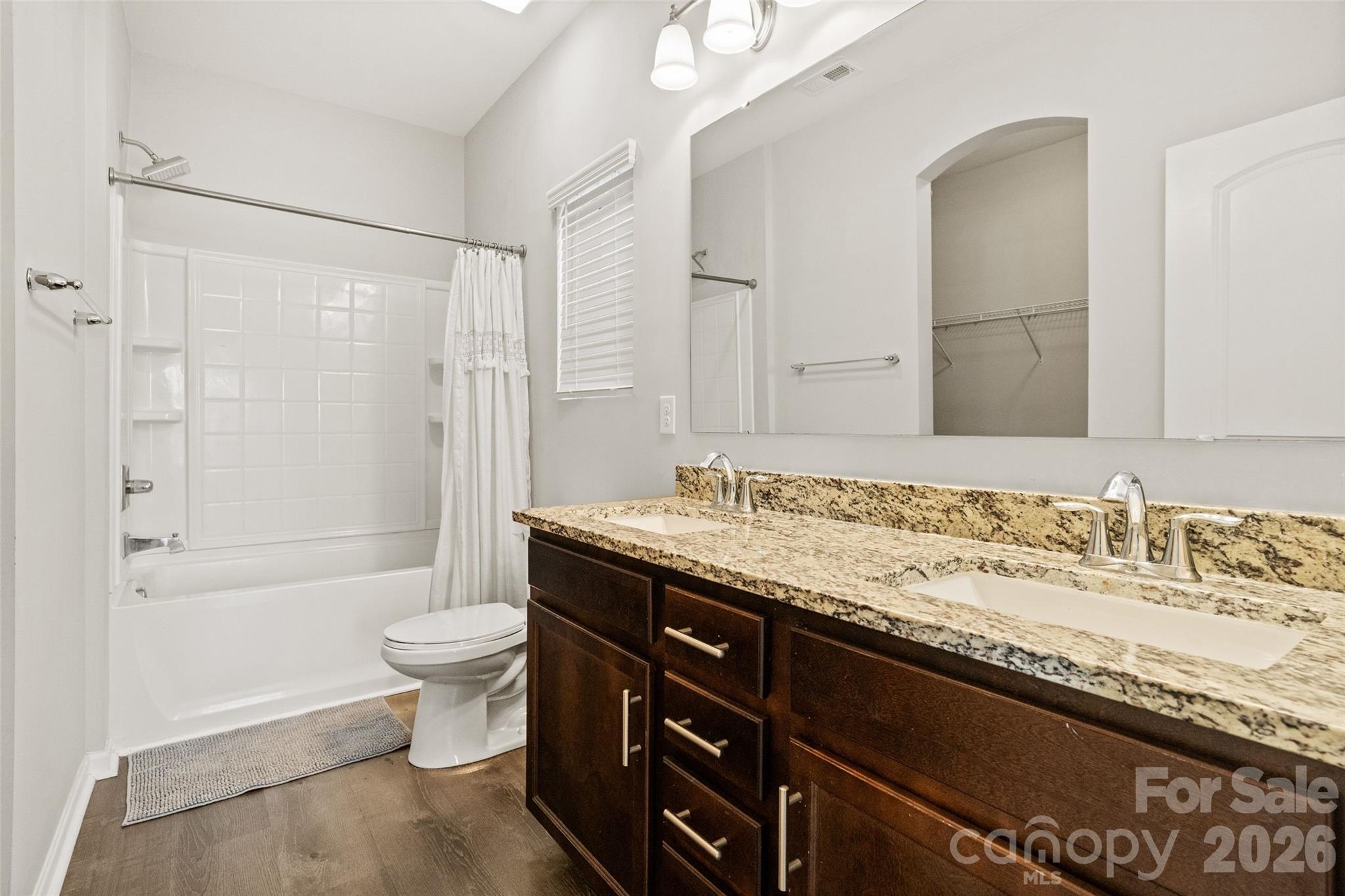 21260 Sanctuary Drive Lancaster, SC 29720 - Photo 27 of 44 a bathroom with a granite countertop sink toilet and shower